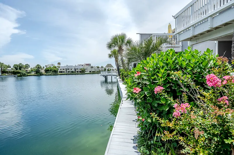 The lake boardwalk and gazebo at Southbay lined with flowers